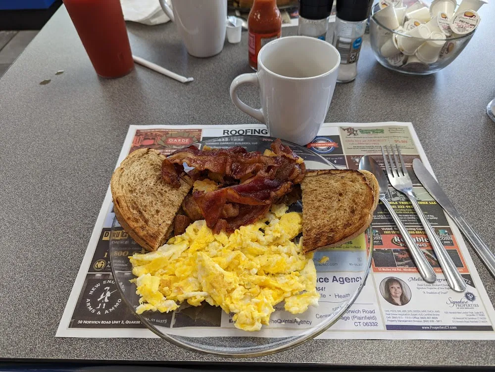 Scrambled Eggs Rye Toast Home Fries with Onions and Bacon
